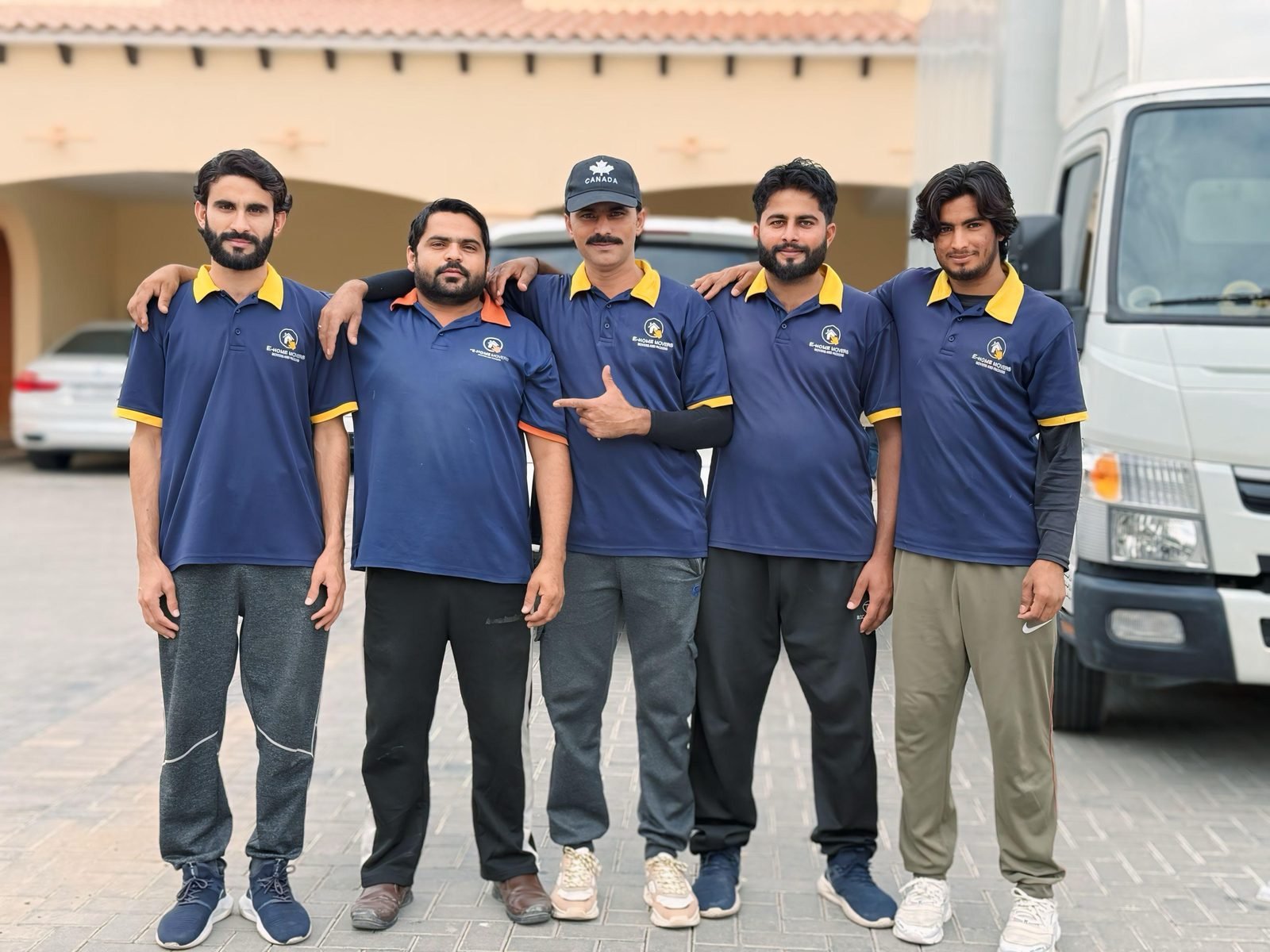 Villa movers and packers in Dubai standing outside a villa before loading